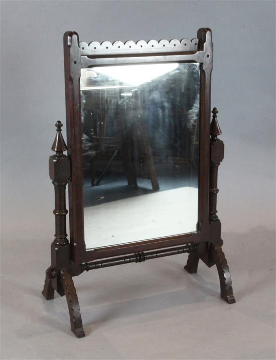 After A.W.N. Pugin - a Victorian Gothic revival carved mahogany swing frame toilet mirror W.63cm, H.92cm